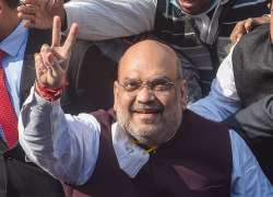 Kolkata: Union Home Minister Amit Shah flashes victory sign during his visit to Swami Vivekanandas ancestral house, in Kolkata, Saturday, Dec. 19, 2020.