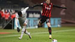 Frankfurt's Andre Silva, right, and Leverkusen's Leon Bailey challenge for the ball during a German Bundesliga soccer match between Eintracht Frankfurt and Bayer Leverkusen in Frankfurt, Germany, Wednesday, Dec. 23