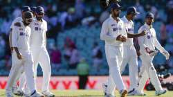 Indian players walk from the field at the close of play on day three of the third cricket test between India and Australia at the Sydney Cricket Ground, Sydney, Australia, Saturday, Jan. 9