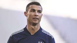 Juventus' Cristiano Ronaldo walks on the pitch during the Serie A soccer match between Juventus and Bologna, at the Allianz Stadium in Turin, Italy, Sunday, Jan. 24