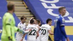 Leeds United's Stuart Dallas celebrates with teammates after scoring his side's opening goal during the English Premier League soccer match between Leicester City and Leeds United