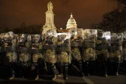 District of Columbia National Guard stand outside the Capitol after a day of rioting protesters.