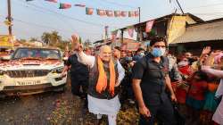 Union Home Minister Amit Shah waves at party workers during a roadshow in Namkhana, South 24 Paraganas on Thursday.