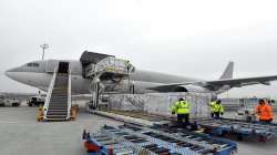 Boxes containing vaccines are unloaded from a Hungarian Airbus 330 cargo plane as the first batch of the vaccine against the new coronavirus produced by Sinopharm of China arrives at Budapest Liszt Ferenc International Airport in Budapest, Hungary.