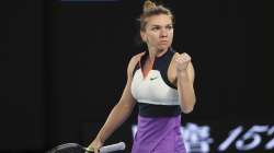 Romania's Simona Halep celebrates a point win over Poland's Iga Swiatek during their fourth round match at the Australian Open tennis championship in Melbourne, Australia, Sunday, Feb. 14