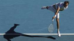 Russia's Daniil Medvedev serves to compatriot Andrey Rublev during their quarterfinal match at the Australian Open tennis championship in Melbourne, Australia, Wednesday, Feb. 17, 2021