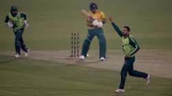 Pakistan's Mohammad Nawaz, right, celebrates after taking the wicket of South Africa's Reeza Hendricks, center, during the 3rd Twenty20 cricket match between Pakistan and South Africa at the Gaddafi Stadium, in Lahore, Pakistan, Sunday, Feb. 14