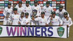 Pakistan's team pose for a photograph with the winning trophy of the test series at the end of the second cricket test match between Pakistan and South Africa at the Pindi Stadium in Rawalpindi, Pakistan, Monday, Feb. 8