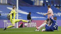 Chelsea's Hakim Ziyech, right, scores his side's second goal during the English FA Cup quarterfinal soccer match between Chelsea and Sheffield United at the Stamford Bridge stadium in London, Sunday, March 21