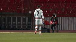 Portugal's Cristiano Ronaldo holds the captain's armband, right, reacts during the World Cup 2022 group A qualifying soccer match between Serbia and Portugal at the Rajko Mitic stadium in Belgrade, Serbia, Saturday, March 27