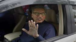  Arif Alvi, then a lawmaker from Imran Khan's Tehreek-e-Insaf ruling party waves to media after filing his nomination papers in the presidential election, in Islamabad, Pakistan.