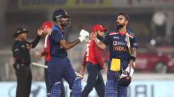 Hardik Pandya of India embraces Virat Kohli as they leave the field following their innings during the 5th T20 International between India and England at Narendra Modi Stadium on March 20