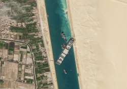 Satellite file image from Planet Labs Inc, the cargo ship MV Ever Given sits stuck in the Suez Canal