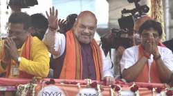 Union Home Minister Amit Shah during a roadshow in support of BJP candidates ahead of the third phase of West Bengal Assembly polls, at Baruipur Paschim in South 24 Parganas.