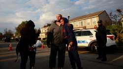 Hazel Washington is embraced after addressing a crowd with her anger at the Columbus Police at the shooting of her niece following a fatal police shooting near Legion Lane on the east side of Columbus, Ohio