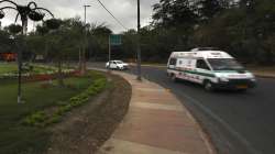 An ambulance carrying a patient drives past a Coronavirus awareness poster on a deserted street. (Representational image)