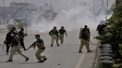 Police fire tear gas to disperse angry supporters of Tehreek-e-Labiak Pakistan, a radical Islamist political party, protesting against the arrest of their party leader, Saad Rizvi, in Peshawar, Pakistan. Two demonstrators and a policeman were killed Tuesday in violent clashes between Islamists and police in Pakistan, hours after authorities arrested Rizvi in the eastern city of Lahore, a senior official and local media reported.