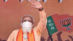 Prime Minister Narendra Modi gestures during an election campaign rally in support of his party candidates, during the ongoing West Bengal assembly polls, at Joynagar in South 24 Parganas district.