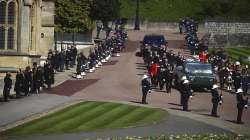 Members of the Royal family follow the coffin of Britain's Prince Philip during the funeral inside Windsor Castle in Windsor, England.