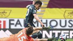 Leeds United's Rodrigo scores his side's fourth goal during the English Premier League soccer match between Burnley and Leeds United at Turf Moor in Burnley, England, Saturday May 15