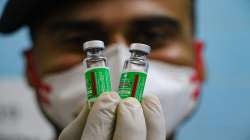 A medic show a vial containing doses of Covishield vaccine during a countrywide inoculation drive against the coronavirus.