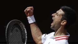 Serbia's Novak Djokovic celebrates after winning a point to Greece's Stefanos Tsitsipas during their quarter-final match at the Italian Open tennis tournament, in Rome, Saturday, May 15