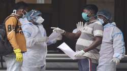 Relatives of Covid patient interact with health worker outside the State Government run Covid hospital in Kolkata.