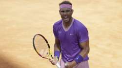 Spain's Rafael Nadal celebrates after winning his semi-final match against United States' Reiley Opelka at the Italian Open tennis tournament, in Rome, Saturday, May 15