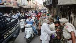 Police force shopkeepers to close shops during the start of lockdown imposed by Punjab State government to curb the spread of coronavirus cases.