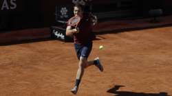 Taylor Fritz of the United States returns the ball to Britain's Daniel Evans during their match at the Italian Open tennis tournament, in Rome, Monday, May 10