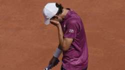 Austria's Dominic Thiem reacts as he plays Spain's Pablo Andujar during their first round match of the French Open tennis tournament at the Roland Garros stadium Sunday, May 30