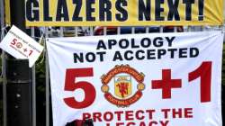 Banners near the stadium as fans protest against the Glazer family, owners of Manchester United, before their Premier League match against Liverpool at Old Trafford, Manchester, England, Sunday, May 2