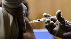 A health worker is administered COVID-19 vaccine at a hospital in Kolkata, India.