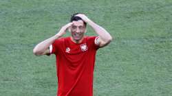 Poland's Robert Lewandowski smiles during training session at the La Cartuja stadium in Seville, Spain, Friday, June 18