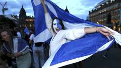 Scotland fans celebrate the Euro 2020 soccer championship group D match between England and Scotland, held at London's Wembley stadium, in Glasgow, Scotland, Friday, June 18