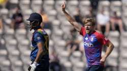 England's David Willey, right, celebrates taking the wicket of Sri Lanka's Danushka Gunathilaka during the third T20 international cricket match between England and Sri Lanka at The Ageas Bowl in Southampton, England, Saturday, June 26