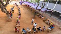 Coimbatore: People wait to recieve the token for Covid-19 vaccine at the Ramanathapuram health care centre in Coimbatore.