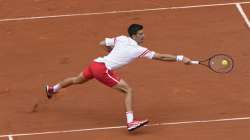 Serbia's Novak Djokovic plays a return to Italy's Lorenzo Musetti during their fourth round match on day 9, of the French Open tennis tournament at Roland Garros in Paris, France, Monday, June 7