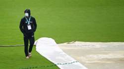 Devon Conway of New Zealand walks across the outfield as play is delayed on Day 4 of the ICC World Test Championship Final between India and New Zealand at The Hampshire Bowl on June 21