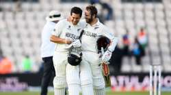 Kane Williamson and Ross Taylor of New Zealand celebrate victory as they walk off on the Reserve Day of the ICC World Test Championship Final between India and New Zealand at The Hampshire Bowl on June 23