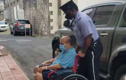 Mehul Choksi is taken in a wheelchair to the Magistrates court by police after his arrest for illegal entry into the country, in Roseau, Dominica, Wednesday, June 2
 