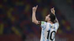 Argentina's Lionel Messi celebrates scoring his side's opening goal on a penalty kick during a qualifying soccer match against Chile for the FIFA World Cup Qatar 2022 in Santiago del Estero, Argentina, Thursday, June 3