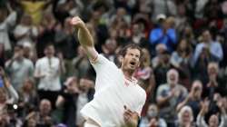 Britain's Andy Murray celebrates winning the men's singles match against Georgia's Nikoloz Basilashvili on day one of the Wimbledon Tennis Championships in London, Monday June 28