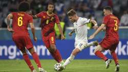 Italy's Ciro Immobile takes a shot during a Euro 2020 soccer championship quarterfinal match between Belgium and Italy at the Allianz Arena in Munich, Germany, Friday, July 2