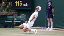 Sebastian Korda of the US plays a return during the men's singles fourth round match against Russia's Karen Khachanov on day seven of the Wimbledon Tennis Championships in London, Monday, July 5