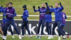 England's Harry Kane, right, warms-up with teammates during a training session at St George's Park, Burton upon Trent, England, Tuesday July 6