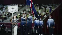 Snaefridur Sol Jorunnardottir and Anton Mckee, of Iceland, carry their country's flag during the opening ceremony in the Olympic Stadium at the 2020 Summer Olympics, Friday, July 23, 2021, in Tokyo