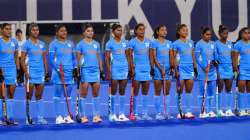 Team India stands on the south pitch of Oi Hockey Stadium before a women's field hockey match agains