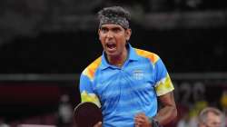 Sharath Kamal exults after taking a point off China's Olympic champion Ma Long in Tokyo on Tuesday. sharath kamal