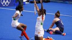 India forward Vandana Katariya, left, runs to embrace forward Rani Rampal